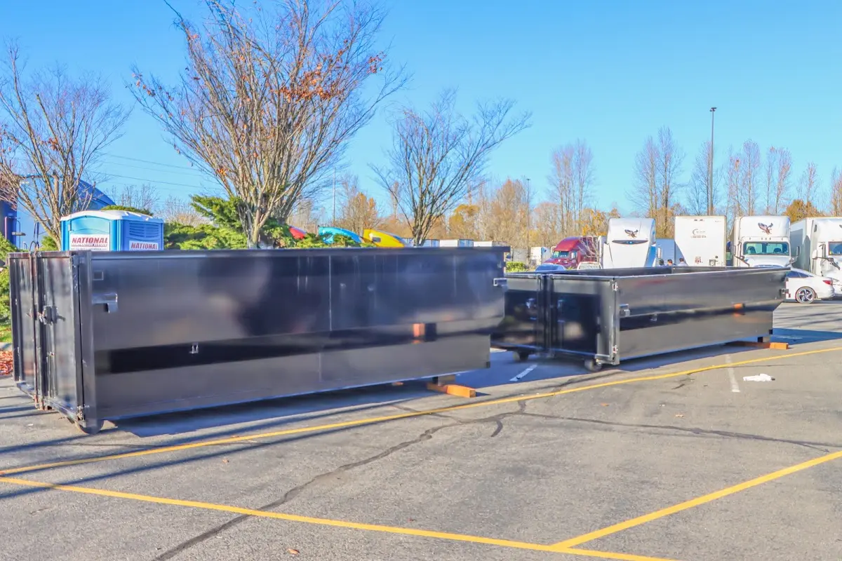 Professional dumpster rental service with roll-off container on residential driveway in Milton-Freewater